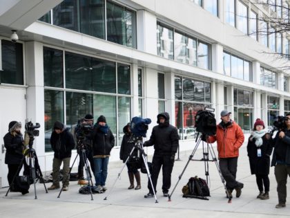 Members of the press wait outside one of the office buildings used by independent prosecutor and former FBI director Robert Mueller on March 22, 2019 in Washington, DC. - US President Donald Trump went on air Friday to double down on his attempt to discredit a massive probe into his …