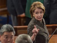 US House Minority Leader Nancy Pelosi chats with colleagues before US President Barack Obama delivers the State of the Union address at the US Capitol in Washington on January 20, 2015. AFP PHOTO/NICHOLAS KAMM (Photo credit should read NICHOLAS KAMM/AFP/Getty Images)