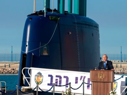 A file picture taken on January 12, 2016 shows Israeli Prime Minister Benjamin Netanyahu delivering a speech during a ceremony for the arrival of the German-made INS Rahav, the fifth Israeli Navy submarine, at the Israeli military port of Haifa. Germany has delayed signing a deal with Israel advancing the …