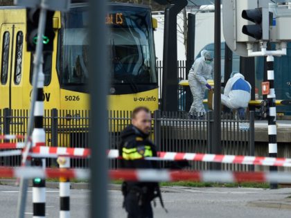 Policemen and rescuers are at work, on March 18, 2019 in Utrecht, near a tram where a gunman opened fire killing at least three persons and wounding several in what officials said was a possible terrorist incident. (Photo by JOHN THYS / AFP) (Photo credit should read JOHN THYS/AFP/Getty Images)