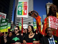 OAKLAND, CALIFORNIA - FEBRUARY 21: Oakland Unified School District students, teachers and parent carry signs as they march to the Oakland Unified School District headquarters on February 21, 2019 in Oakland, California. Nearly 3,000 teachers in Oakland have gone on strike and are demanding a 12 percent retroactive raise. (Photo …