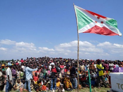 People gather to attend a ceremony marking the adoption of the new constitution passed in a May referendum, on June 7, 2018 in Bugendana. - The constitution, approved on May 17 by a majority of voters around the densely-populated central African country, will allow Nkurunziza to run for office twice …