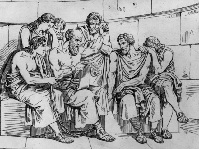 Circa 410 BC, The Greek philosopher Socrates (469 - 399 BC) teaches his doctrines to the young Athenians whilst awaiting his execution. Original Artwork: An engraving after a painting by Pinelli. (Photo by Hulton Archive/Getty Images)