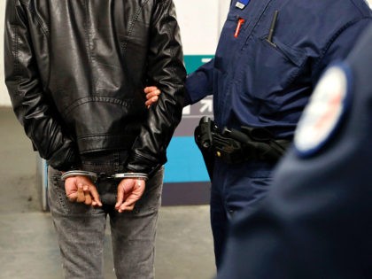 Police officers of the Brigade des Réseaux Ferrés (BRF - Railway Network Squad) detain a man during a patrol in the metro in Paris on November 2, 2016. / AFP PHOTO / FRANCOIS GUILLOT (Photo credit should read FRANCOIS GUILLOT/AFP/Getty Images)