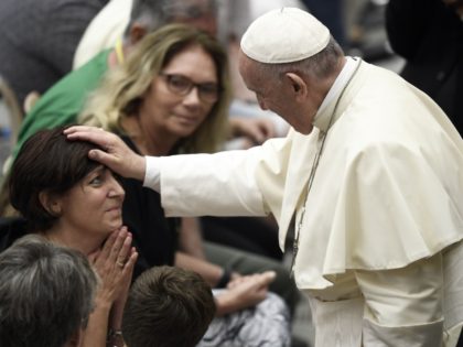 Pope Francis (R) blesses a woman during his weekly general audience in Paul VI Hall at The Vatican on August 8, 2018. (Photo by FILIPPO MONTEFORTE / AFP) (Photo credit should read FILIPPO MONTEFORTE/AFP/Getty Images)