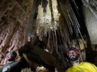 Boaz Langford (R), Member of HUs Cave Research Center and head of the Malham Cave Mapping Expedition, along with Yoav Negev (L), chairman of the Israel Cave Explorers Club and project leader of the Malham Cave Mapping Expedition, show journalists salt stalactites in the Malham cave inside Mount Sodom, located …