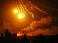 TOPSHOT - A picture taken in eastern Syrian province of Deir Ezzor shows explosions following shelling by the US-backed forces on the Islamic State group's embattled holdout of Baghouz, on March 11, 2019. - US-backed Syrian Democratic Forces pounded the last scrap of land held by the Islamic State group …