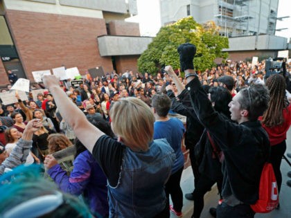 Protesters from Students For a Democratic Society demonstrate on the University of Utah ca