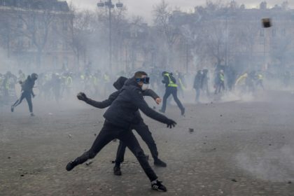 Masked rioters fought pitched battles with riot police by the Arc de Triomphe during the 'yellow vest' protests 'It's the apocalypse': Paris rioters run amok at yellow vest rallies