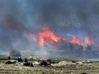 In smouldering last redoubt, IS hide among the reeds