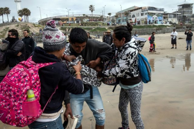 US border agents fire tear gas at Central American migrants