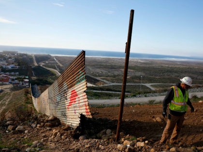 Stewart Williams works with a crew removing border to be replaced with new border wall Wednesday, Jan. 9, 2019, seen from Tijuana, Mexico. U,S. President Donald Trump walked out of his negotiating meeting with congressional leaders Wednesday — "I said bye-bye," he tweeted— as efforts to end the 19-day partial …