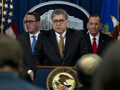 Attorney General William Barr accompanied by other officials, speaks during a news conference to address elder financial exploitation and law enforcement actions, at Department of Justice in Washington, Thursday, March 7, 2019. (AP Photo/Jose Luis Magana)