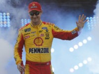 Joey Logano waves to fans during driver introductions prior to the start of the NASCAR Cup series auto race at Richmond Raceway in Richmond, Va., Saturday, April 13, 2019. (AP Photo/Steve Helber)