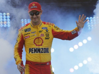 Joey Logano waves to fans during driver introductions prior to the start of the NASCAR Cup
