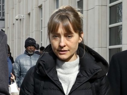 Allison Mack leaves Brooklyn federal court, in New York, Wednesday, Feb. 6, 2019. She is a