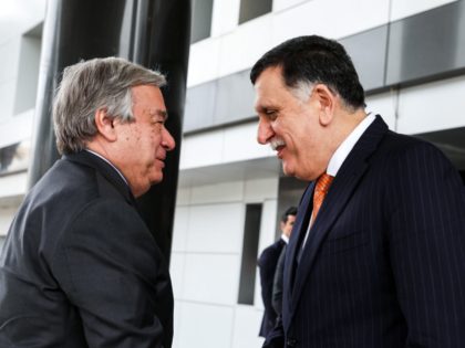 Libyan unity government Prime Minister Fayez al-Sarraj (R) shakes hands with United Nations Secretary General Antonio Guterres at his office in the Libyan capital Tripoli on April 4, 2019. (Photo by - / AFP) (Photo credit should read -/AFP/Getty Images)