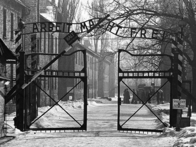 The gates of the Nazi concentration camp at Auschwitz, Poland, circa 1965. The sign above