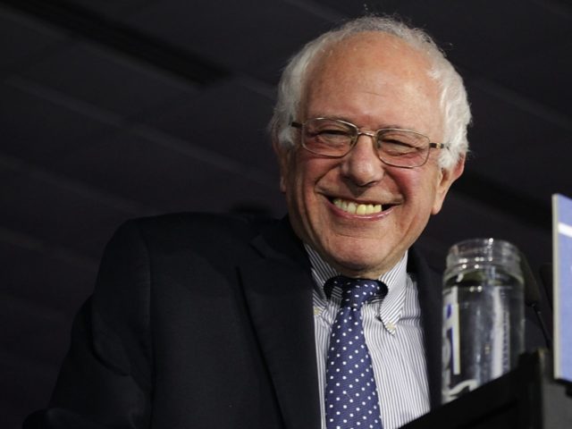 Democratic presidential candidate Sen. Bernie Sanders smiles as he speaks to supporters du