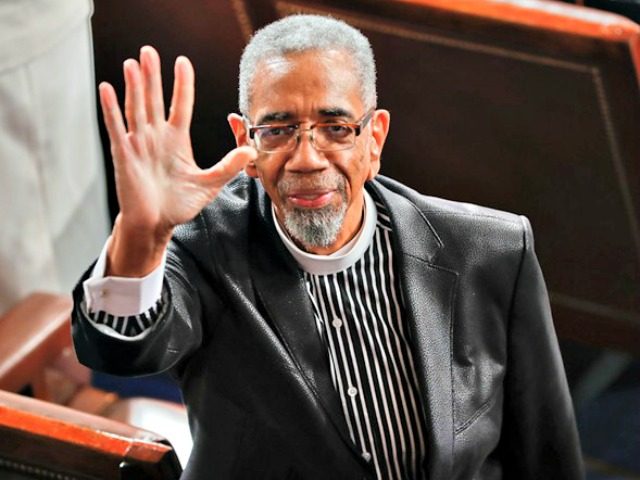 Rep. Bobby Rush, D-Ill., waves to guests in the balcony as he takes his seat on Capitol Hi