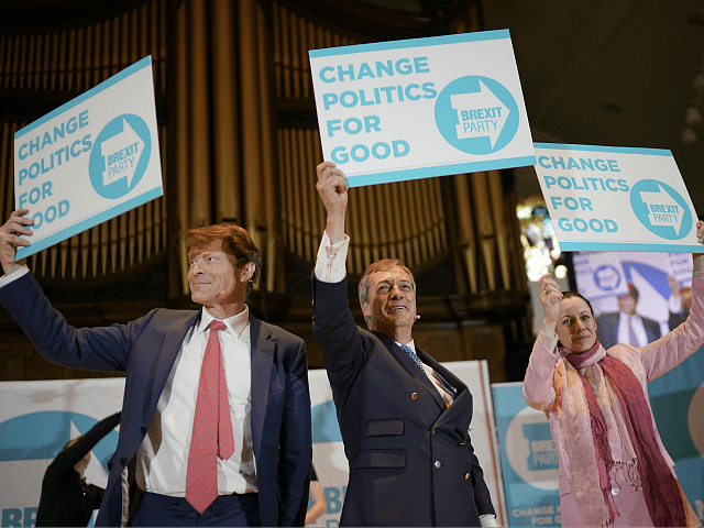 NOTTINGHAM, ENGLAND - APRIL 20: Brexit party chairman Richard Tice (L), Nigel Farage and Annunziata Rees-Mogg wave placards at the end of the Brexit Party rally at the Albert Hall conference centre on April 20, 2019 in Nottingham, England. Farage, the former leader of the U.K. Independence Party, has launched …