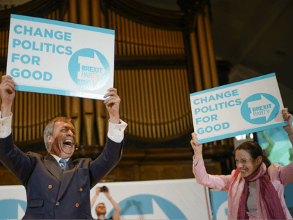 NOTTINGHAM, ENGLAND - APRIL 20: Annunziata Rees-Mogg, sister of Jacob Rees Mogg, a freelance journalist and candidate for the Brexit Party in the European Parliament elections, and Nigel Farage wave party placrds at the Brexit Party rally at the Albert Hall conference centre on April 20, 2019 in Nottingham, England. …