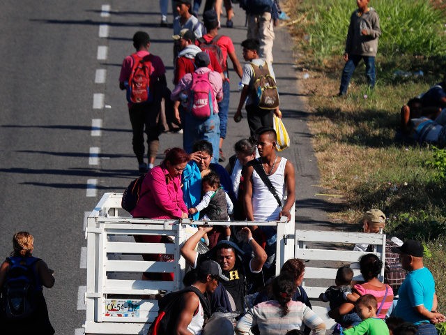 Central American migrants, part of the caravan hoping to reach the U.S. border, move on a road in Tapachula, Chiapas State, Mexico, Friday, Jan. 18,2019. Hundreds of Central American migrants are walking and hitchhiking through the region as part of a new caravan of migrants hoping to reach the United …