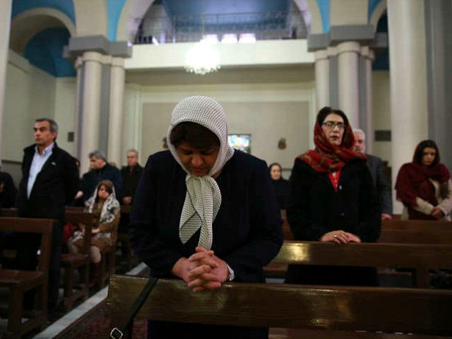 Iranian Christian worshippers attend the Christmas mass at the Saint Joseph Chaldean-Assyrian Catholic church, in Tehran, Iran, Monday, Dec. 25, 2017. Iranian Christians are a minority and recognized by the constitution in the Muslim country and are represented in the parliament. (AP Photo/Vahid Salemi)