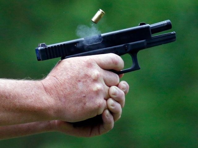 In this April 30, 2016 photograph, a spent round is ejected through gun smoke from a participant's cautomatic handgun during the live fire portion of a enhanced concealed carry class sponsored by Crestview Baptist Church for members and area residents in Petal, Miss. The 20 participants received hands on assistance …