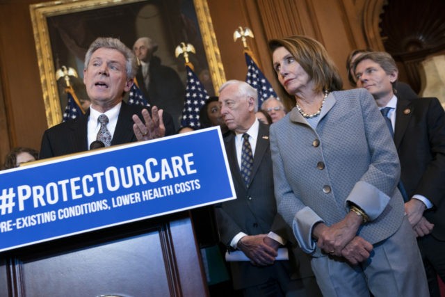 Speaker of the House Nancy Pelosi, D-Calif., joined at left by Energy and Commerce Committee Chair Frank Pallone, D-N.J., leads an event to announce legislation to lower health care costs and protect people with pre-existing medical conditions, at the Capitol in Washington, Tuesday, March 26, 2019. The Democratic action comes …
