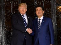 US President Donald Trump greets Japanese Prime Minister Shinzo Abe as he arrives for talks at Trump's Mar-a-Lago resort in Palm Beach, Florida, on April 17, 2018. / AFP PHOTO / MANDEL NGAN (Photo credit should read MANDEL NGAN/AFP/Getty Images)