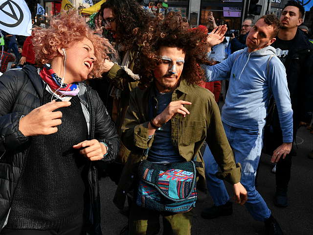 LONDON, ENGLAND - APRIL 15: Environmental campaigners block Oxford Circus during a coordin