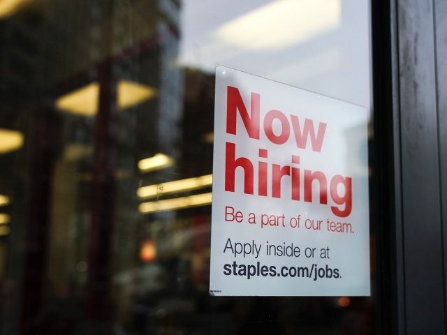 NEW YORK, NY - JANUARY 4: A 'now hiring' sign hangs on the door of a Staples store in Lowe