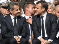 French President Emmanuel Macron (R) and his predecessor Nicolas Sarkozy attend a ceremony in tribute to World War II resistance fighters killed at the plateau des Glieres, near Thorens-Glieres in the French Alps, on March 31, 2019. (Photo by ludovic MARIN / POOL / AFP) (Photo credit should read LUDOVIC …