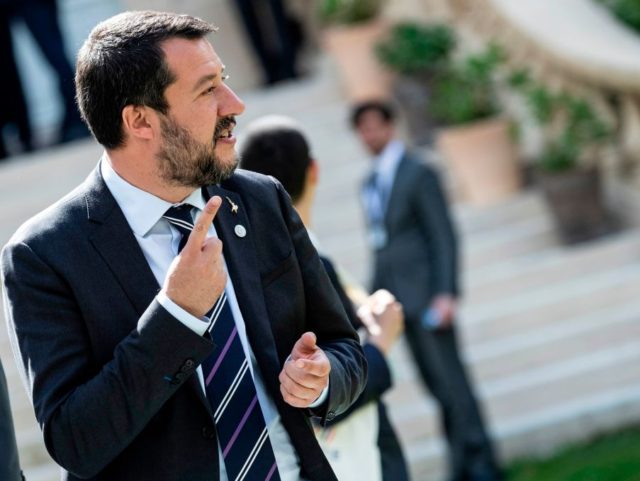 Italys Interior Minister and Deputy Prime Minister Matteo Salvini reacts before a group ph