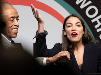 US Representative Alexandria Ocasio-Cortez (R) is welcomed by the Reverend Al Sharpton speaks during a gathering of the National Action Network April 5, 2019 in New York. (Photo by Don Emmert / AFP) (Photo credit should read DON EMMERT/AFP/Getty Images)