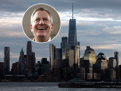 (INSET: Bill de Blasio) A man jogs in front of the skyline of lower Manhattan on April 16,