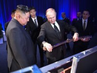 Russian President Vladimir Putin and North Korean leader Kim Jong Un exchange gifts following their talks at the Far Eastern Federal University campus on Russky island in the far-eastern Russian port of Vladivostok on April 25, 2019. (Photo by Alexey NIKOLSKY / SPUTNIK / AFP) (Photo credit should read ALEXEY …