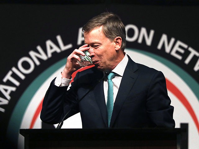 NEW YORK, NEW YORK - APRIL 05: Democratic presidential candidate former Colorado Gov. John Hickenlooper takes a drink as he speaks at the National Action Network's annual convention on April 5, 2019 in New York City. A dozen 2020 Democratic presidential candidates will speak at the organization's convention this week. …