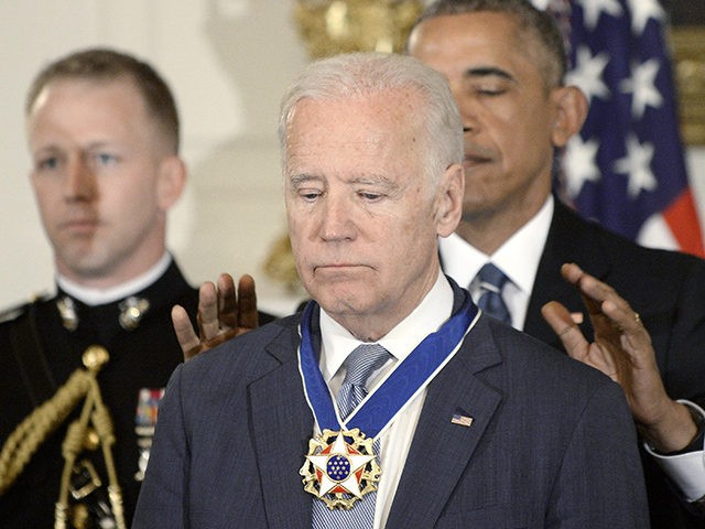 WASHINGTON, DC - JANUARY 12: (AFP OUT) U.S. President Barack Obama (R) presents the Medal of Freedom to Vice-President Joe Biden during an event in the State Dining room of the White House, January 12, 2017 in Washington, DC. (Photo by Olivier Douliery-Pool/Getty Images)