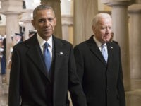 WASHINGTON, DC - JANUARY 20: President Barack Obama and Vice President Joe Biden walk through the Crypt of the Capitol for Donald Trump's inauguration ceremony, in Washington, January 20, 2017. (Photo by J. Scott Applewhite - Pool/Getty Images)