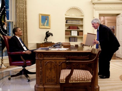 In this handout image provided by The White House, President Barack Obama (L) speaks with