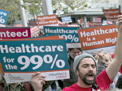 In the April 26, 2017 photo, supporters of single-payer health care march to the Capitol in Sacramento, Calif. (AP Photo/Rich Pedroncelli)