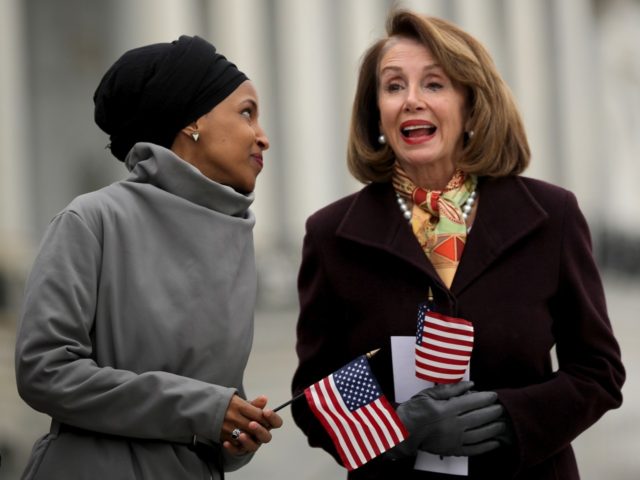 WASHINGTON, DC - MARCH 08: Rep. Ilhan Omar (D-MN) (L) talks with Speaker of the House Nancy Pelosi (D-CA) during a rally with fellow Democrats before voting on H.R. 1, or the People Act, on the East Steps of the U.S. Capitol March 08, 2019 in Washington, DC. With almost …