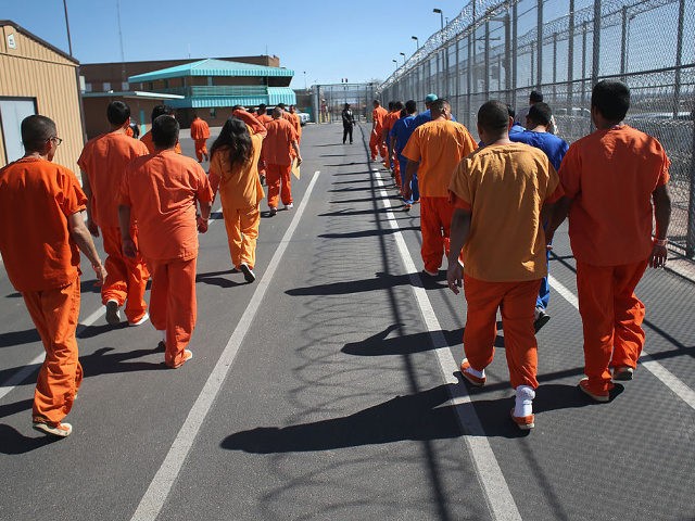 FLORENCE, AZ - FEBRUARY 28: Immigrant detainees walk through the Immigration and Customs Enforcement (ICE), detention facility on February 28, 2013 in Florence, Arizona. With the possibility of federal budget sequestration, ICE released 303 immigration detainees in the last week from detention facilities throughout Arizona. More than 2,000 immigration detainees …