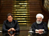 In this photo released by the official website of the office of the Iranian Presidency, President Hassan Rouhani, right, and Pakistani Prime Minister Imran Khan, attend a joint press briefing, after their meeting at the Saadabad Palace in Tehran, Iran, Monday, April 22, 2019. (Iranian Presidency Office via AP)