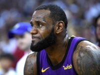 OAKLAND, CA - DECEMBER 25: LeBron James #23 of the Los Angeles Lakers looks on from the bench after he was hurt against the Golden State Warriors during the second half of their NBA Basketball game at ORACLE Arena on December 25, 2018 in Oakland, California. NOTE TO USER: User …
