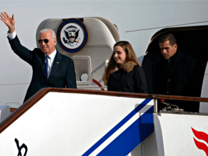This Dec. 4, 2013, file photo shows U.S. Vice President Joe Biden, left, arriving on Air Force Two in Beijing, China, with his son Hunter Biden, right, and his granddaughter Finnegan Biden. As the Vice President travels to Ukraine Saturday, June 7, 2014, his youngest son, Hunter, 44, has been …