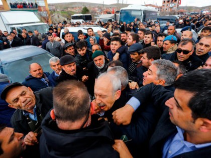 The Chairman of the Republican People's Party (CHP) Kemal Kilicdaroglu (C) is attacked by a protester on April 21, 2019 while attending a funeral ceremony in Ankara's Cubuk district for a soldier killed in fighting against Kurdish militants. - The CHP last month won Ankara and Istanbul mayors' offices in …