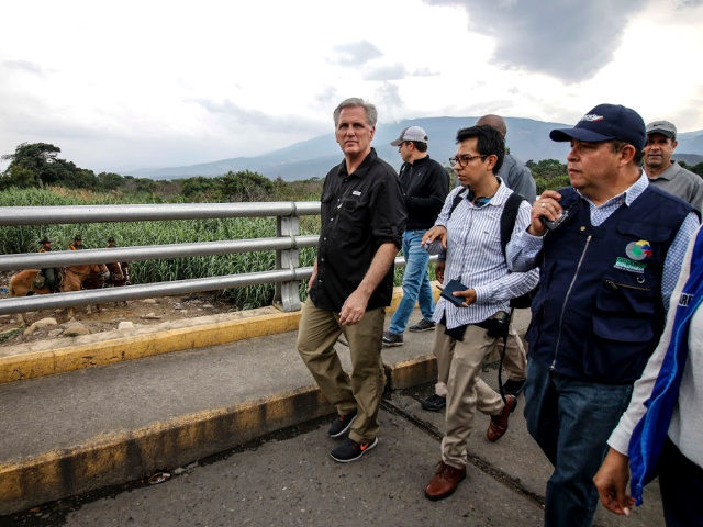 U.S. House Minority Leader Kevin McCarthy (R) walks over the Simon Bolivar International Bridge in Cucuta, Colombia in the border with Venezuela, on April 18, 2019. (Photo by Schneyder MENDOZA / AFP) (Photo credit should read SCHNEYDER MENDOZA/AFP/Getty Images)